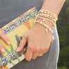 Set of 6 Gold Tone Multicharm Fashion Stretch Bracelets with Pink Beads