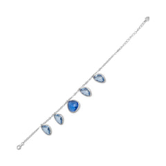 Rhodium Plated Bracelet with Abstract Faceted Blue Glass Drops