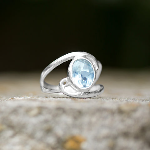 Cut Out Oval Blue Topaz Ring with Swirls