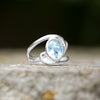 Cut Out Oval Blue Topaz Ring with Swirls